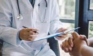 doctor giving a consultation to a patient and explaining medical